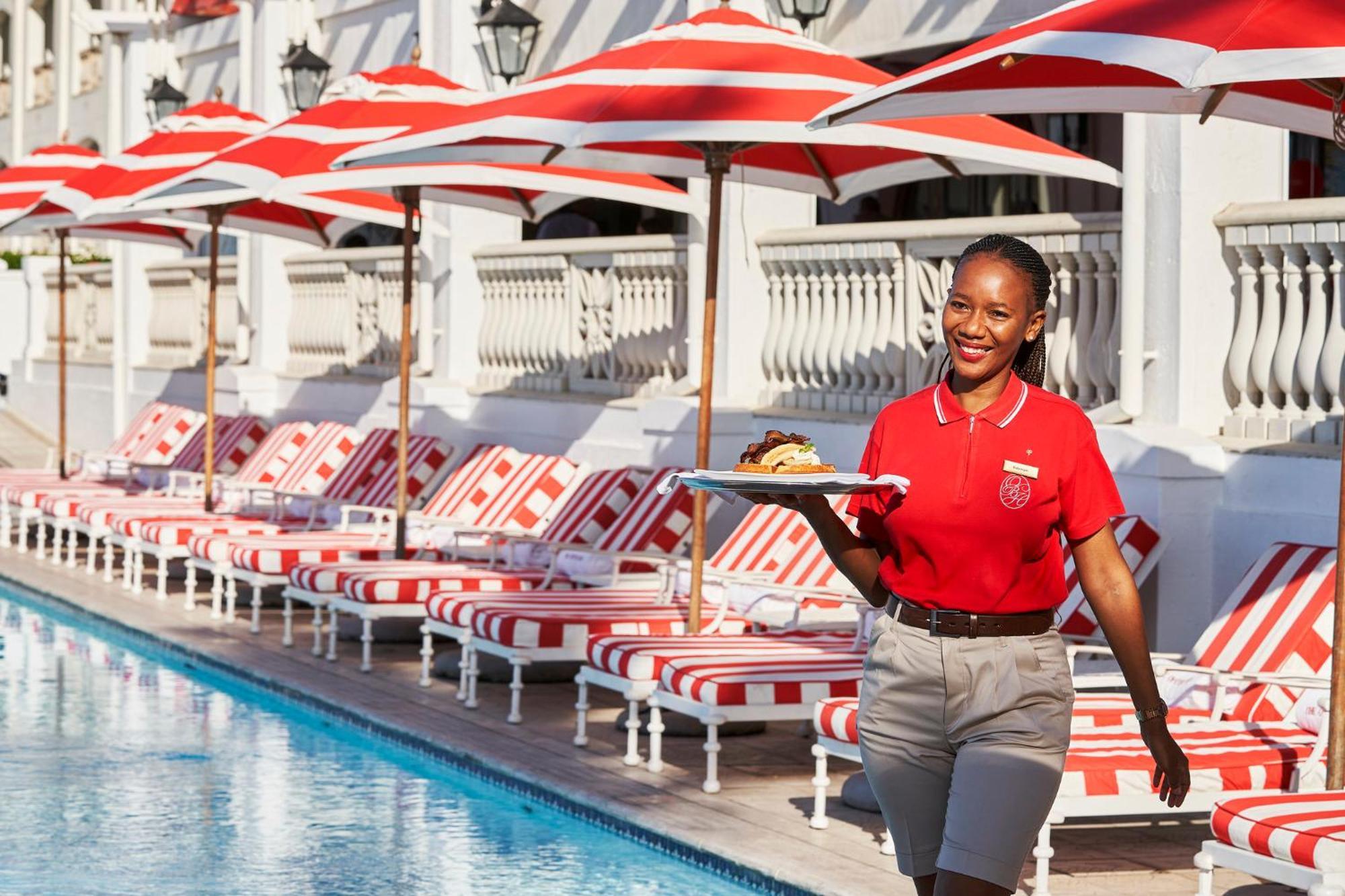 The Oyster Box Hotel Umhlanga Exterior photo A server at the pool at The Standard East Village
